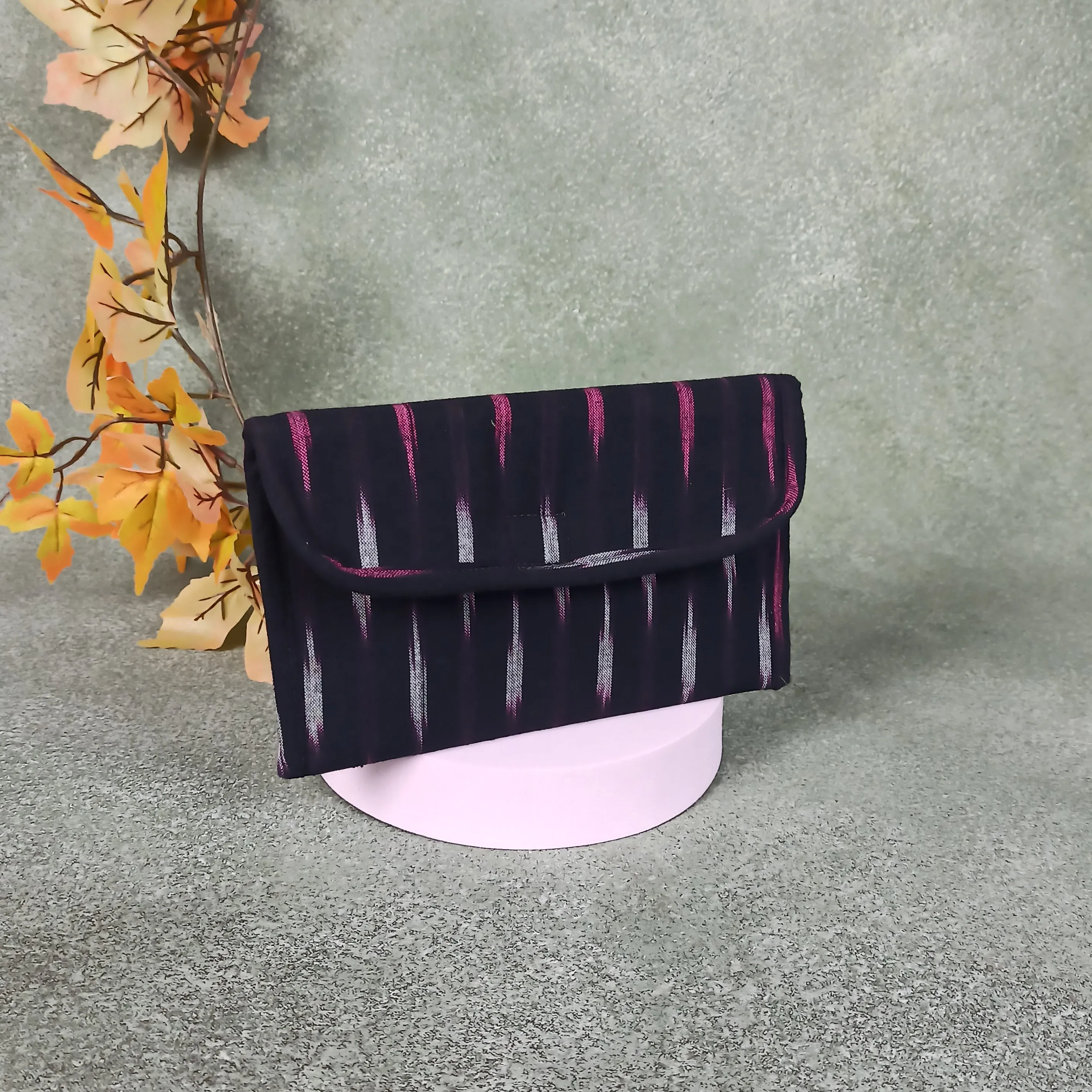 Ikat Clutch Black Colour with Pink Design.